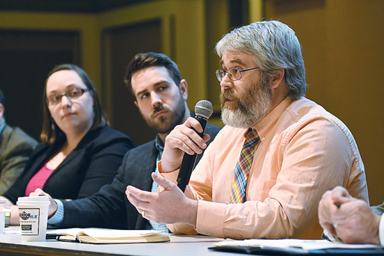 MARK NANCE/Sun-Gazette Dr. Bob Smith of Lycoming College's department of biology gives his the perspective of a biologist concerning energy issues during the first of the Center for Energy and the Future's panel discussion at the Welch Honors Hall Wednesday. Looking on are Dr.s Laura Seddelmeyer, department of history, and Michael Kurtz, department of economics.